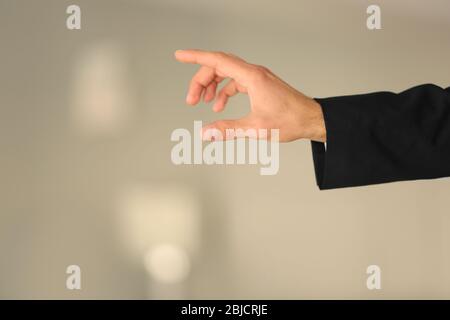 Male hand with finger pointing on blurred background Stock Photo