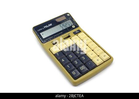 Vintage electronic calculator close up isolated on white background Stock Photo
