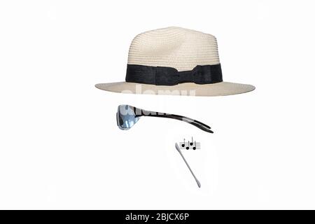 Panama hat,  sun glasses, earbud + music notes. Concept: invisible man,  Modern man, fashion,  streaming, earphones, man of the world, swanky. Stock Photo