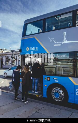 Edinburgh/UK-24/3/18: people getting on the bus to the Edinburgh airport from the station on a Waverley Bridge, a road bridge linking Market Street in Stock Photo