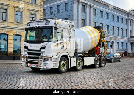 Next generation Scania concrete mixer truck of Kuljetus S Suorsa Ky in city traffic in central Helsinki, Finland. April 29, 2020. Stock Photo