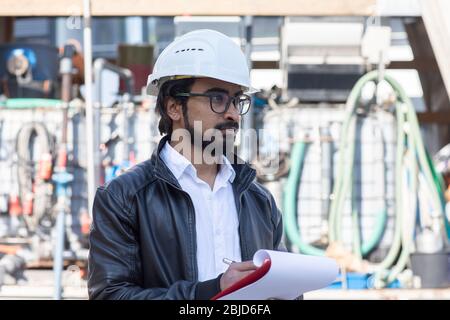service engineer  working outside with helmet Stock Photo
