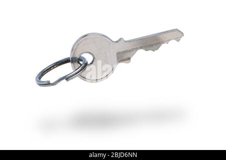 Old metal key on a white background. isolated. Close up. Stock Photo