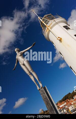 Scarborough lighthouse tower with 'diving belle' sculpture in foreground. Yorkshire England UK Stock Photo