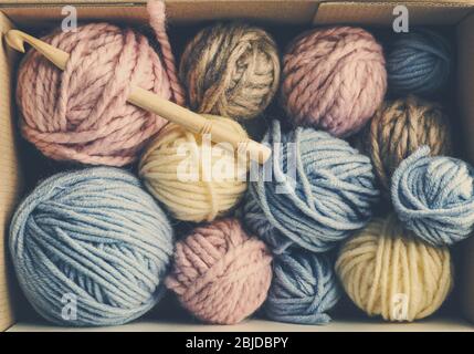 Balls of knitting yarn in box, closeup Stock Photo