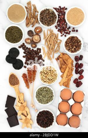 Health food and herbal medicine for vitality & fitness. Foods high in vitamins, minerals, antioxidants, anthocyanins, protein & omega 3. Stock Photo