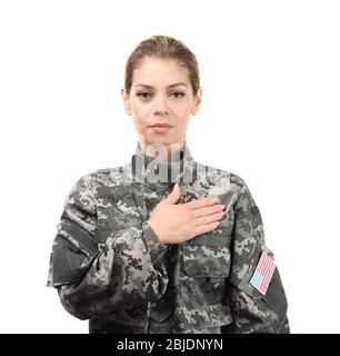 Soldier with hand on heart against USA flag Stock Photo - Alamy