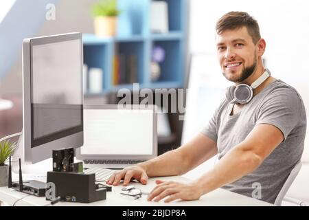 Handsome young programmer working at home Stock Photo