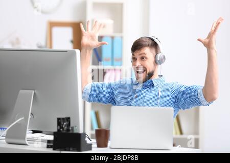 Handsome young programmer working in office Stock Photo