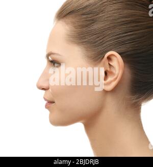 Young beautiful woman on white background. Plastic surgery concept Stock Photo