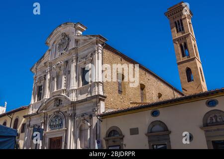 Facade and campanile of the Chiesa di Ognissanti (All-Saints Church) is a Franciscan church in Florence, Tuscany, Italy. Example of baroque architectu Stock Photo