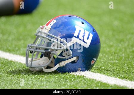 16 September 2012: New York Giants football helmet lays on the turf before the start of a week 2 NFL NFC matchup between the Tampa Bay Buccaneers and Stock Photo