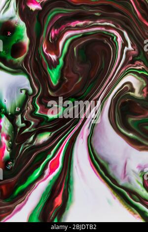 Background of milk and colored diluted paints in it Stock Photo
