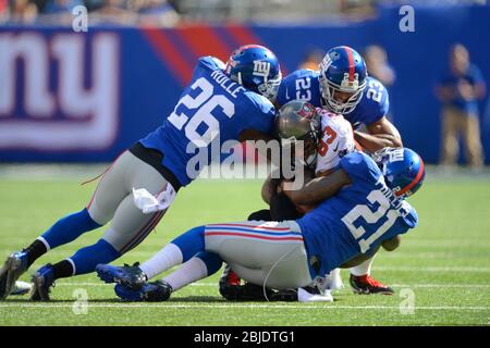 16 September 2012: Tampa Bay Buccaneers wide receiver Vincent Jackson (83) is tackled by New York Giants free safety Antrel Rolle (26), New York Giant Stock Photo