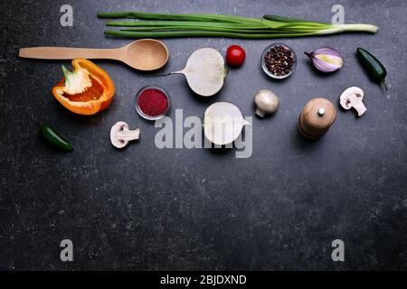 Fresh vegetables and spice on gray background, top view Stock Photo