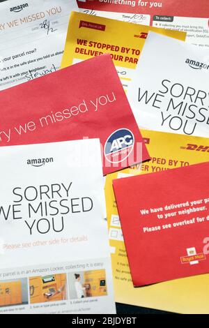 'Sorry we missed you' cards left by parcel delivery companies Stock Photo