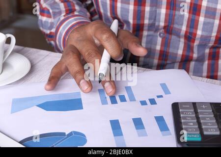 businessman analyzing working on office desk, top view  Stock Photo