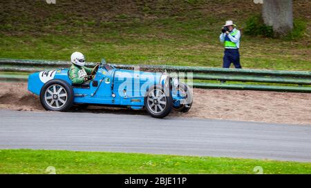 Bugatti Type 37 Classic Racing Car sliding off the track at Prescott Hill, Gloucestershire, England Stock Photo