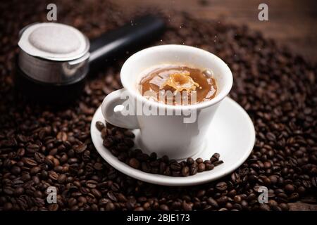 Drops of coffee splashing in a coffe milk, high speed close up Stock Photo