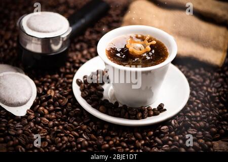 Drops of coffee splashing in a coffe milk, high speed close up Stock Photo