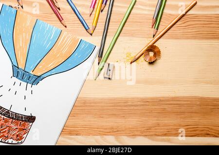 Composition of coloring and pencils on wooden table Stock Photo