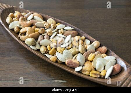 Roasted and salty, mixed nuts and kernels snack Stock Photo