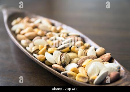 Roasted and salty, mixed nuts and kernels snack Stock Photo