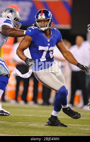 New York Giants' Osi Umenyiora Recovers A Fumble By New England 