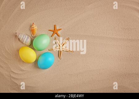 Easter eggs with shell, on sand background Stock Photo