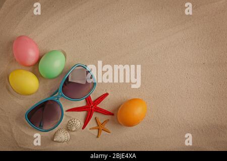 Easter eggs with shell, on sand background Stock Photo