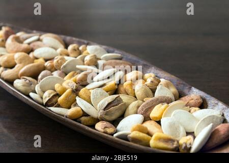 Roasted and salty, mixed nuts and kernels snack Stock Photo