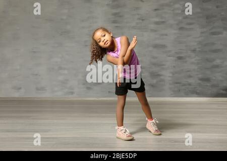 Cute African American girl in dance studio Stock Photo