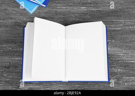 Opened book on grey wooden table Stock Photo