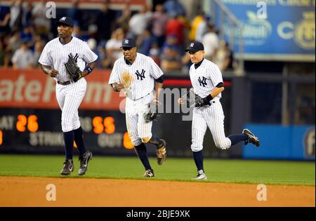 August 21, 2013: New York Yankees left fielder Alfonso Soriano (12), New York Yankees right fielder Curtis Granderson (14) and New York Yankees right Stock Photo