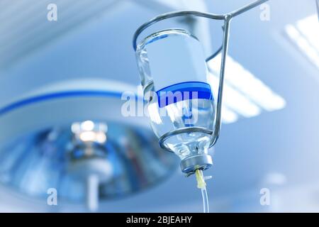 Infusion drip in hospital on blurred background Stock Photo