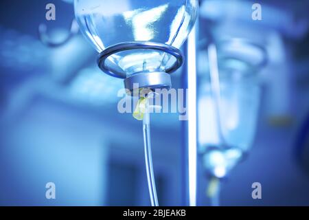 Infusion drip in hospital on blurred background Stock Photo