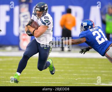 Seattle Seahawks' tight end Ryan Hannam (83) turns upfield after catching a  Matt Hasselbeck pass in the third quarter in Seattle on December 11, 2005.  Trying to pass cover Hannam is San