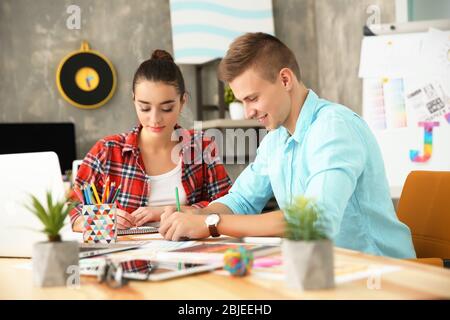 Two young designers at workplace Stock Photo
