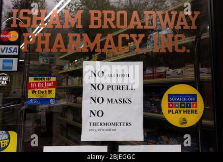 due to shortages in the coronavirus or covid-19 pandemic a pharmacy sign states it has no alcohol, no Purell, no masks, and no thermometers, Stock Photo