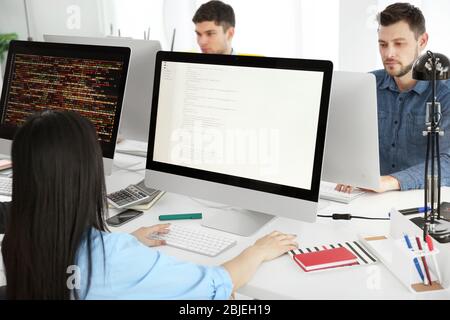 Young programmers working in office Stock Photo