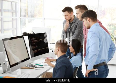 Young programmers working in office Stock Photo