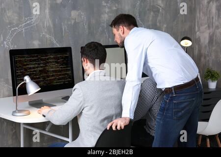 Young programmers working in office Stock Photo