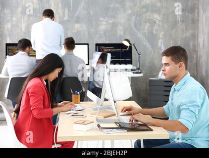 Young programmers working in office Stock Photo