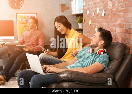 Young programmers resting in office Stock Photo