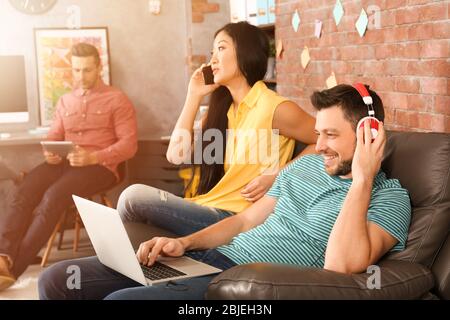 Young programmers resting in office Stock Photo