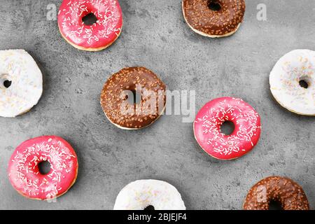 Glazed donuts on color background Stock Photo - Alamy