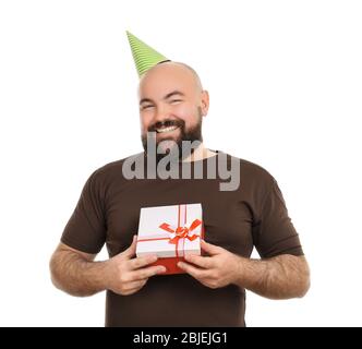 Funny fat man with birthday present on white background Stock Photo