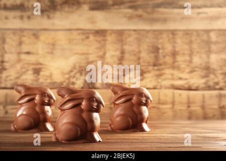 Chocolate Easter bunnies on wooden background Stock Photo