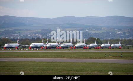 Glasgow, UK. 28 April 2020.   Pictured: A British Airways flight from London Heathrow arrives in Glasgow, which is one of only a handful of scheduled flights into Glasgow today during the Coronavirus (COVID-19) crisis UK extended lockdown.  To date British Airways has made an announcement which sees almost 12,000 staff axed reacting to the pandemic which has hit every major airline, putting some out of business. Credit: Colin Fisher/Alamy Live News. Stock Photo