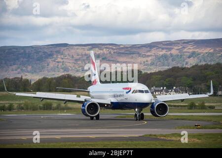 Glasgow, UK. 28 April 2020.   Pictured: A British Airways flight from London Heathrow arrives in Glasgow, which is one of only a handful of scheduled flights into Glasgow today during the Coronavirus (COVID-19) crisis UK extended lockdown.  To date British Airways has made an announcement which sees almost 12,000 staff axed reacting to the pandemic which has hit every major airline, putting some out of business. Credit: Colin Fisher/Alamy Live News. Stock Photo